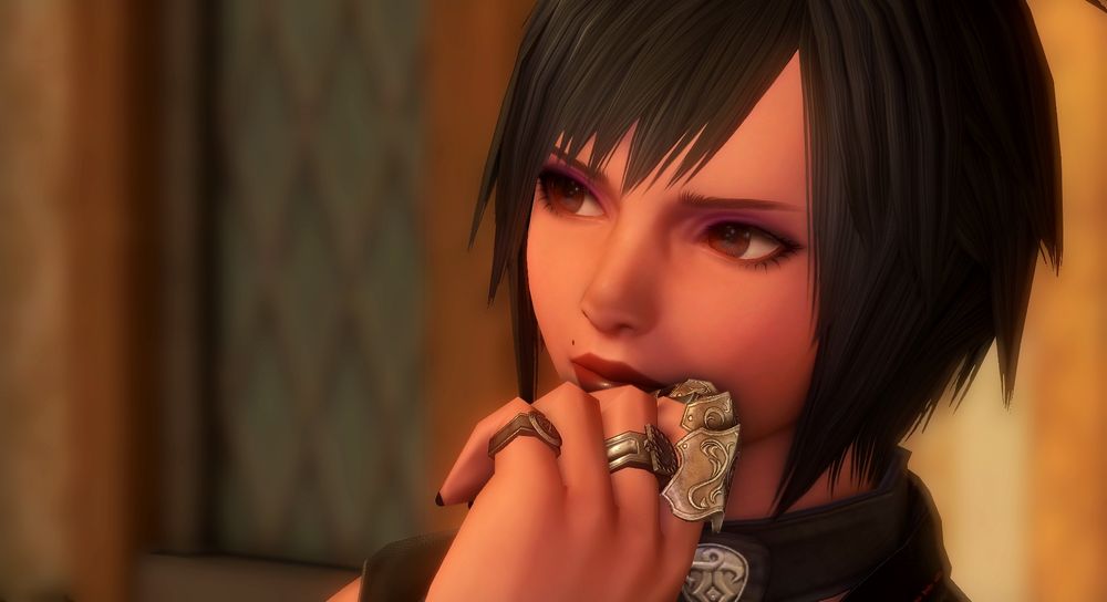 An up close shot of my viera with short black hair cosplaying as Nana Osaki. She has purple eyeshadow, dark red lipstick, and multiple rings on her hand. She is looking pensively away from the camera. 