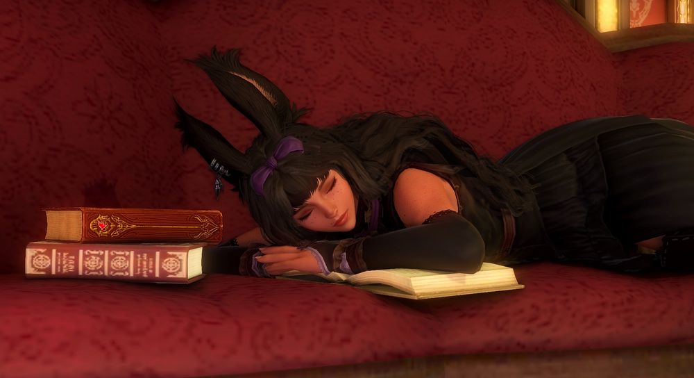 My WoL Viera falling asleep on some open books. 