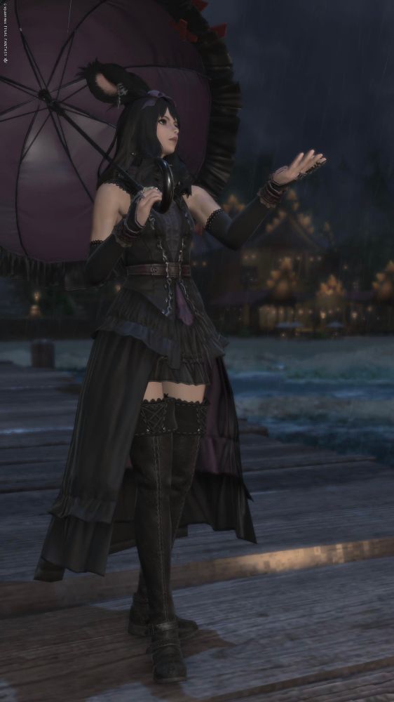 A picture of my OC/Viera as she walks down a beach pier. It is raining and she is holding a black and dark purple umbrella. She is dressed in the edenmorn casting outfit and unironically looks like Wednesday according to my mom.