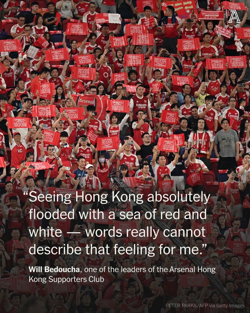 Arsenal supporters cheer at the Kai Tak Stadium in Hong Kong on July 31, 2025, ahead of a friendly exhibition football match against Tottenham Hotspur.