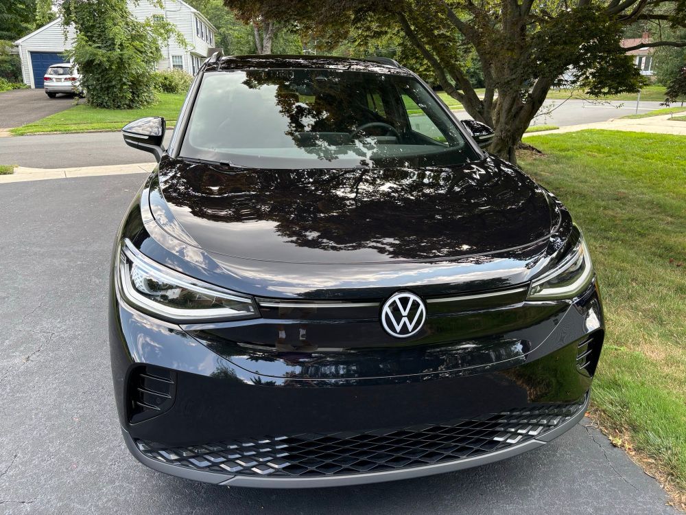 Black VW ID.4 parked in a driveway. 