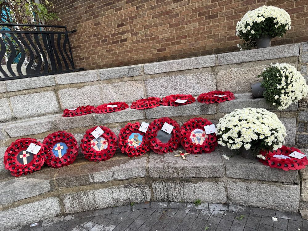 Poppy wreaths at the war memorial at Holy Trinity Church in Hounslow.