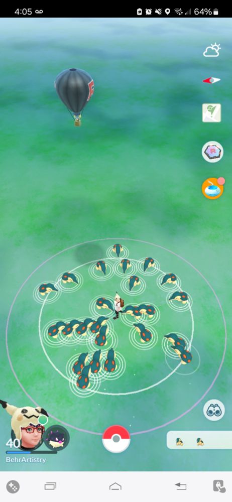 A screenshot from Pokémon GO during Cyndaquil Community Day where the player has tapped on all the Pokémon so there are now 24 Cyndaquil looking towards the player as if they will all attack in a moment.