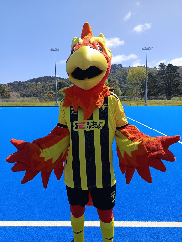 Wellington Phoenix mascot Nixie - an athletic soccer playing phoenix, wearing the clubs new yellow and black home kit.