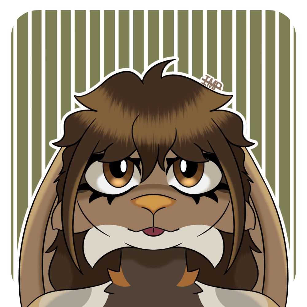 a headshot of Puppy the lop-eared bunny. is looking at the camera and sticking her tongue out.