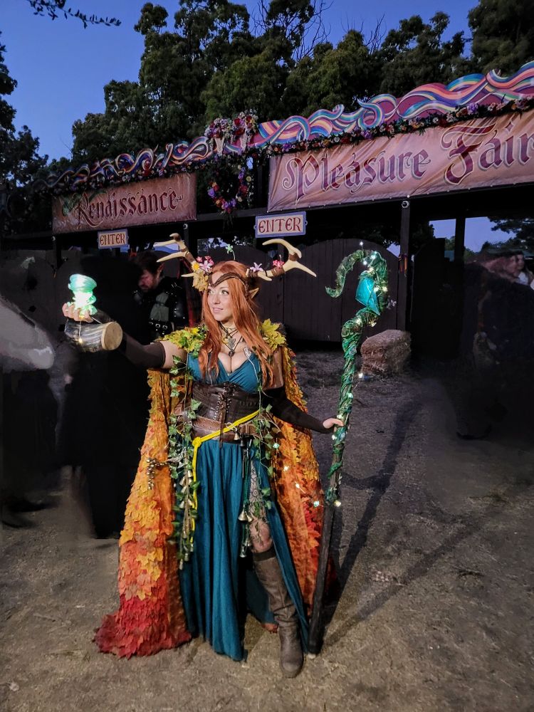 Jem dressed as Keyleth of the Air Ashari in her Voice of the Tempest outfit with a full autumn leaf cloak and Spire of Conflux.