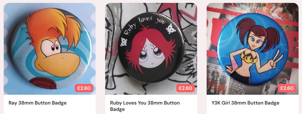 ID: An image showing listings for 3 button badges, the leftmost listing featuring Rayman, the middle listing featuring Ruby Gloom, and the rightmost listing featuring a stylised cartoon girl with brown hair tied into pigtails.