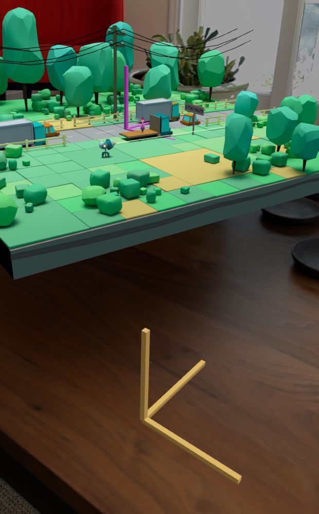 A 3D AR scene positioned above a table, with magenta and school bus yellow coordinate space axes floating in space