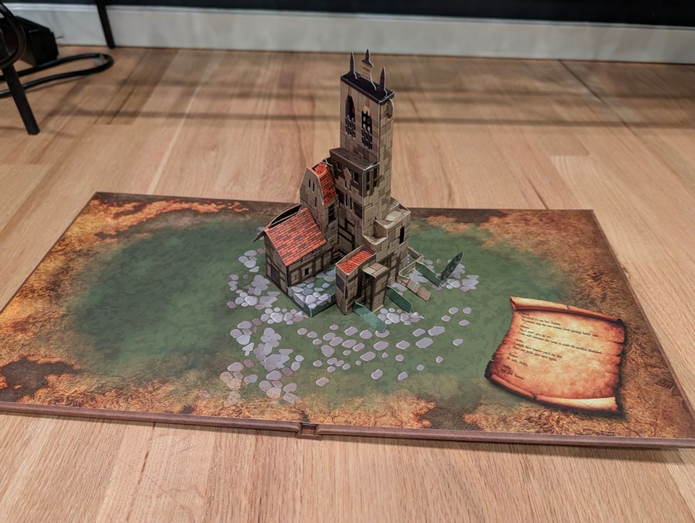 A foldable book that has orbonne's monastery popping up 