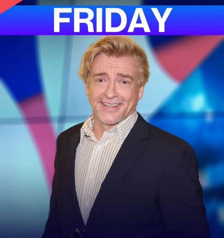 photo of rhys darby. there's a banner above him that says friday.