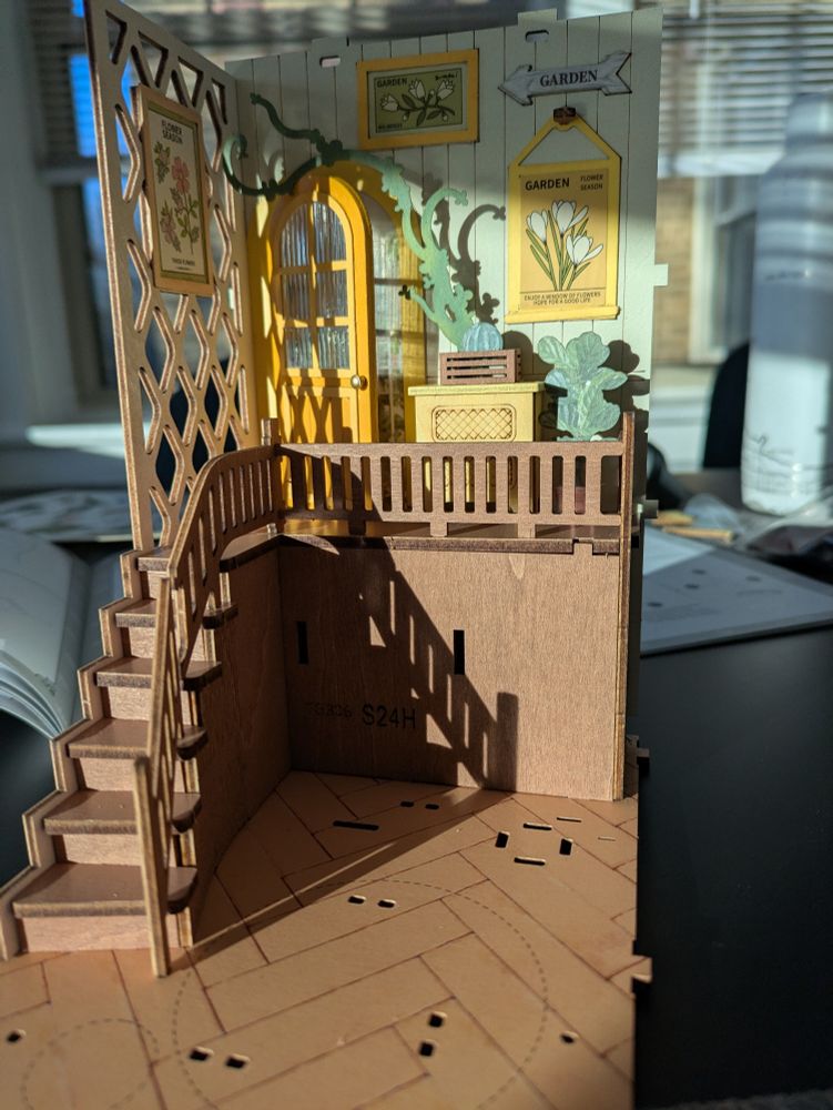 A wider view of the partial miniature showing a staircase railing