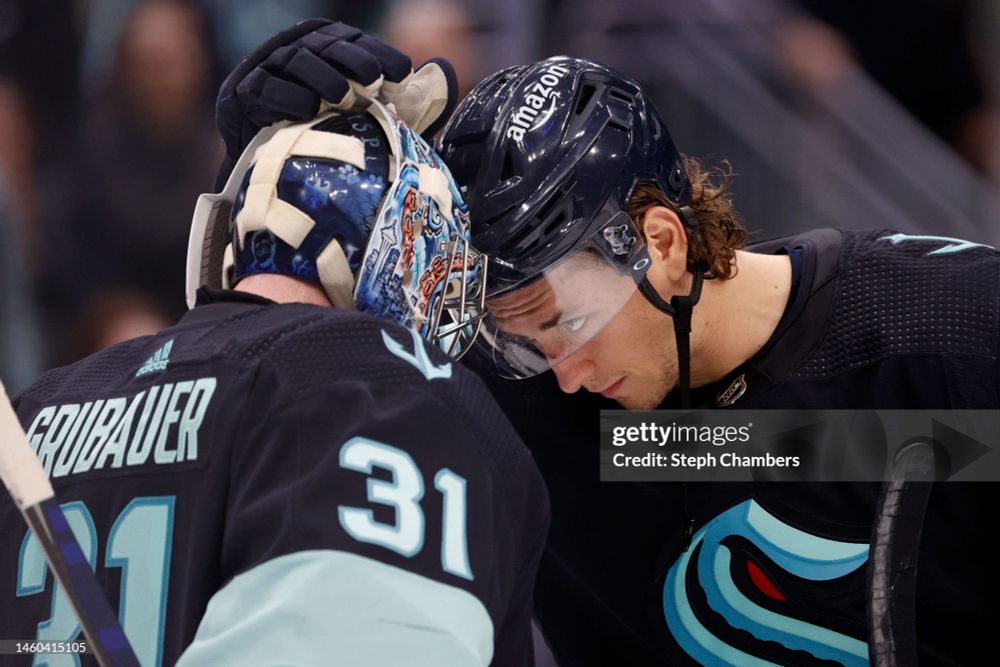 John Hayden, Kraken, on ice praying his forehead to Philipp Grubauer. Bless.