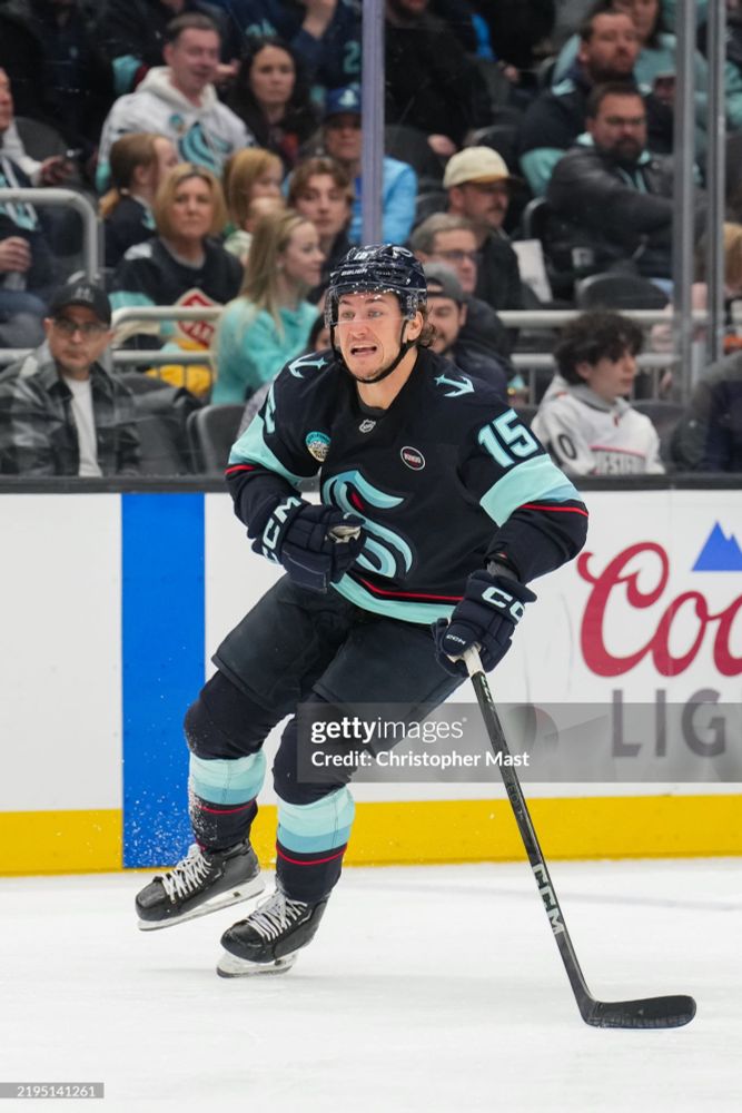 John Hayden, Kraken uniform, on the ice, pulling a funny face. 