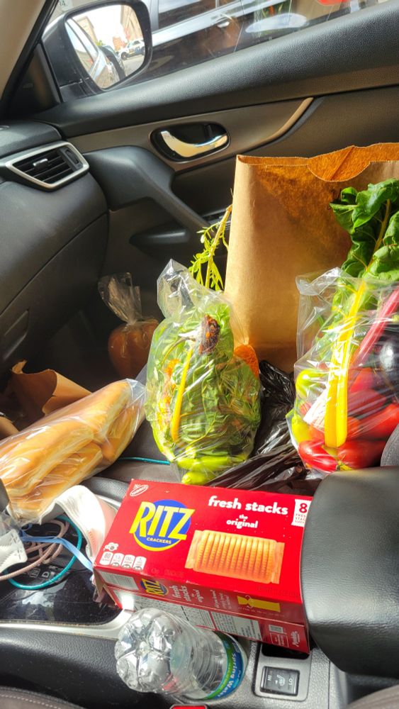 my messy car filled with groceries.