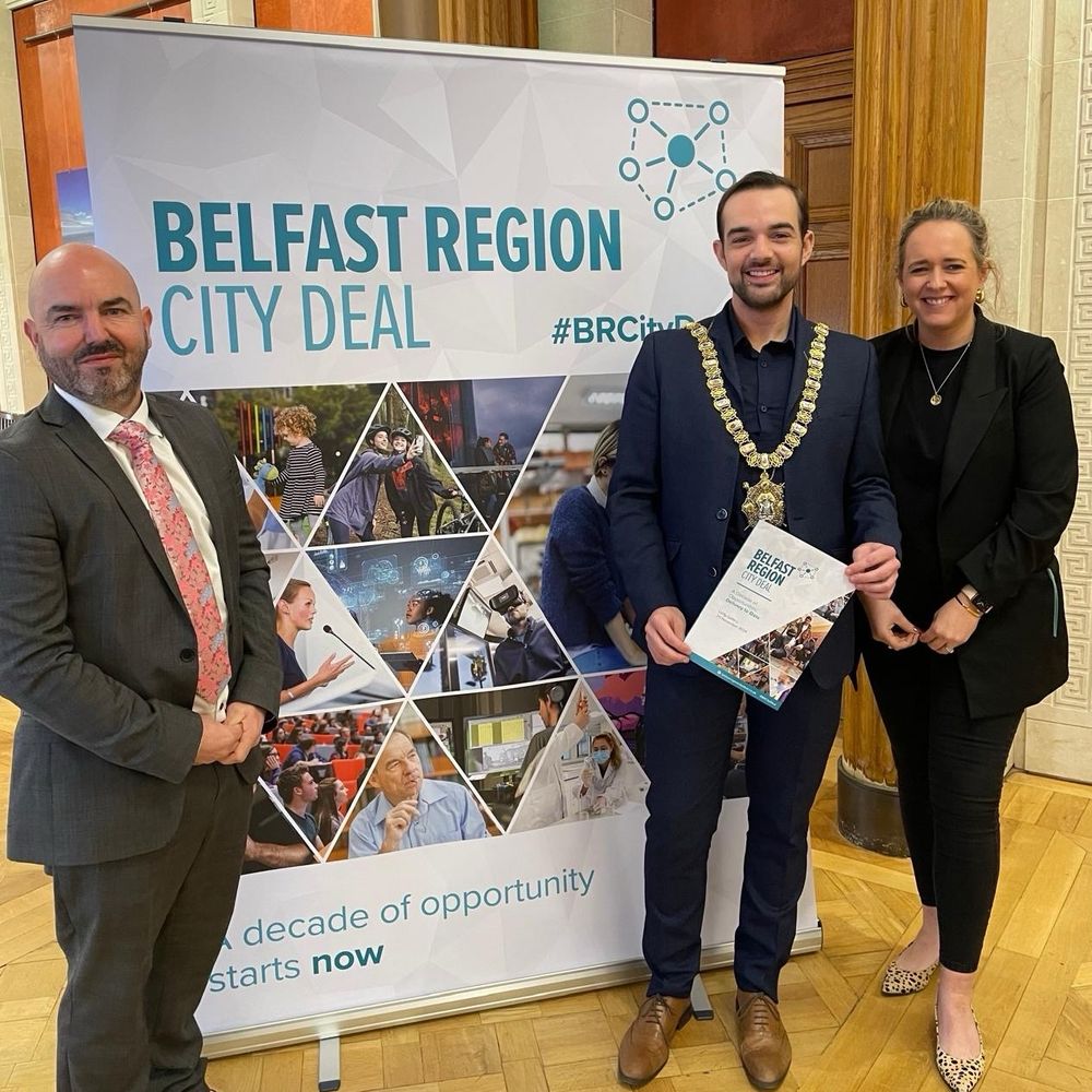 David, Micky & me in front of a Belfast Region City Deal pop-up