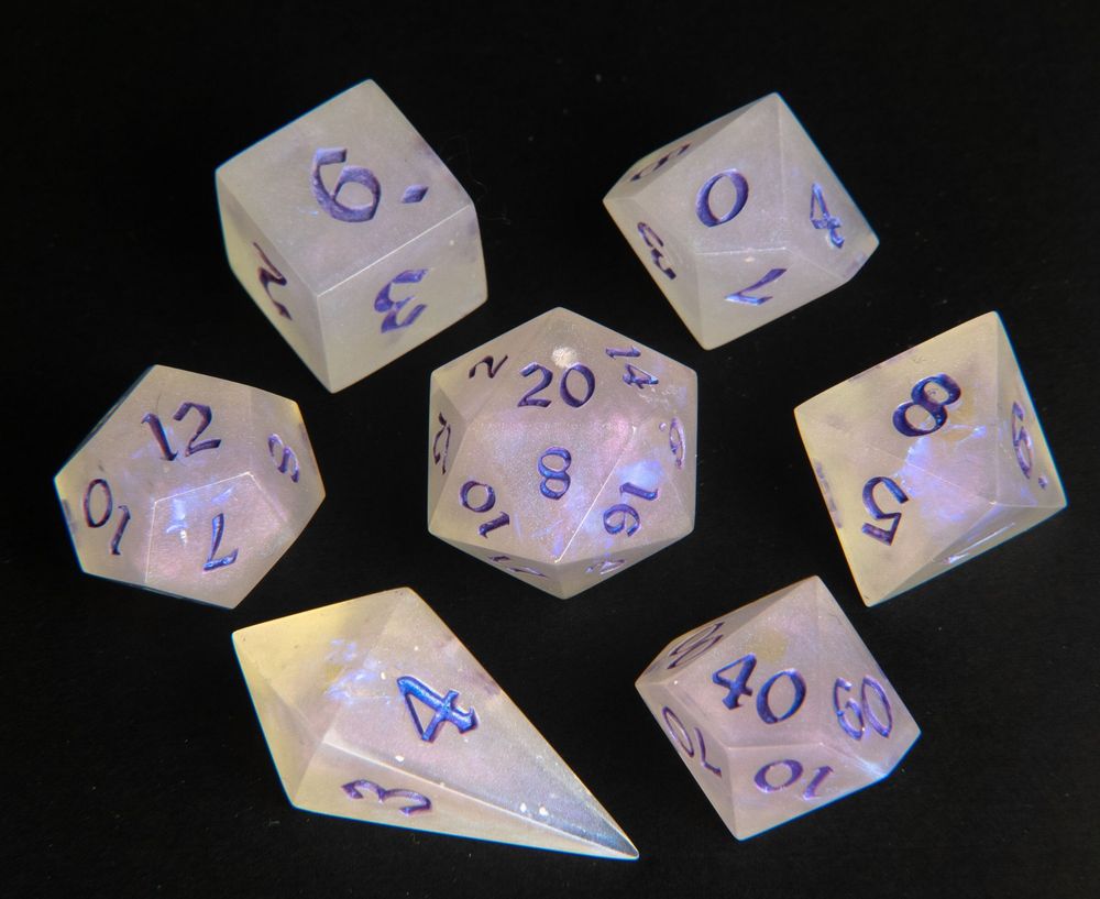 A set of shimmery, pearlescent dice with purple numbers.
