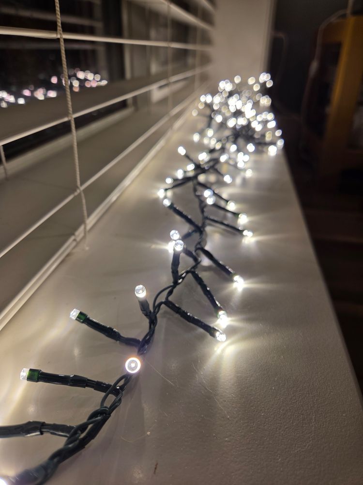 Small white lights on a windowsill