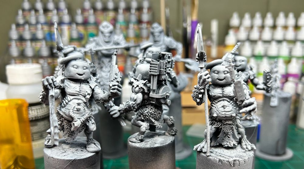 Mashup of Mantic's Molochs with Stay-Puft marshmallow man heads, proton packs, and proton guns.