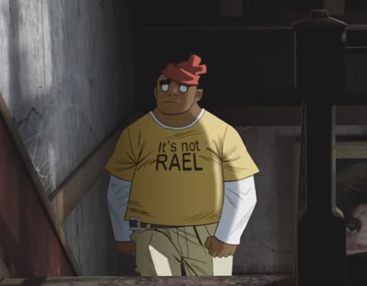 russel from the "saturnz barz" music video wearing a t-shirt that says "It's not RAEL"