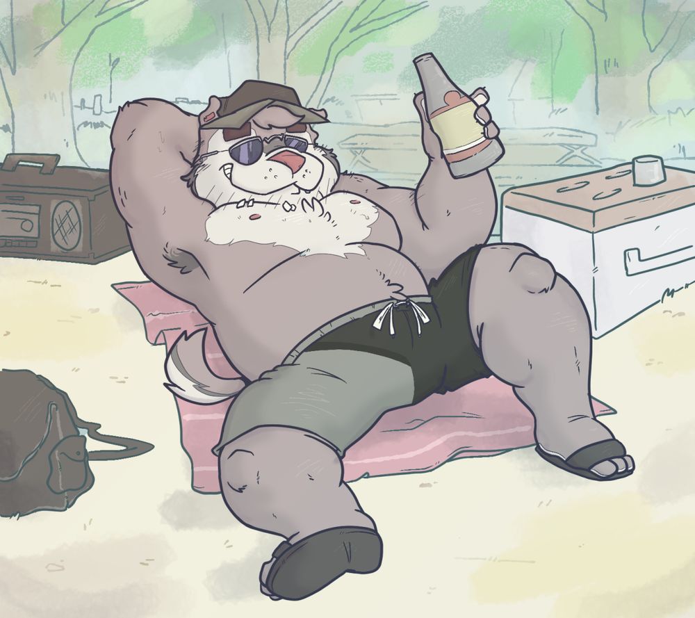 Anthro Badger laying on beach towel