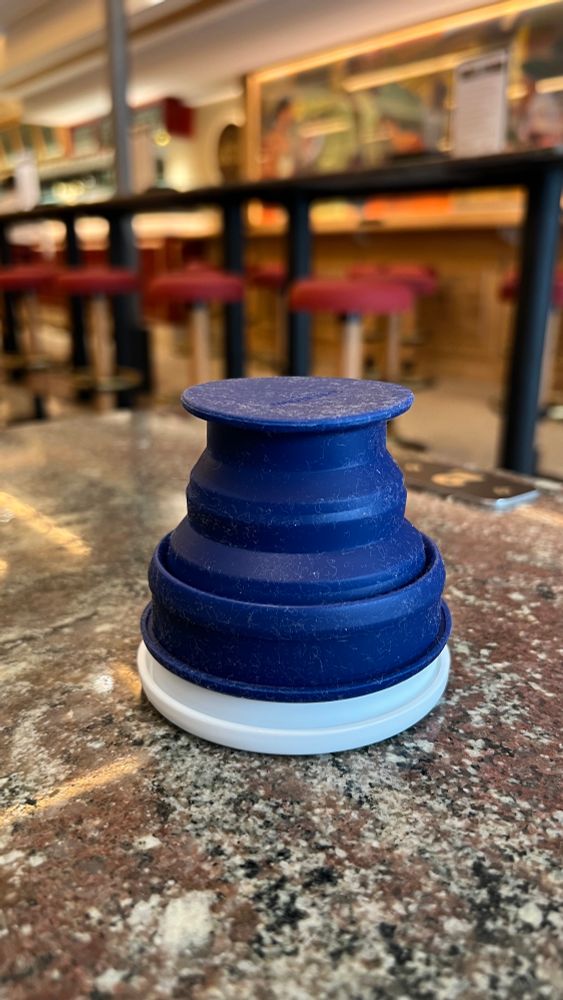 A dark blue rubber cup