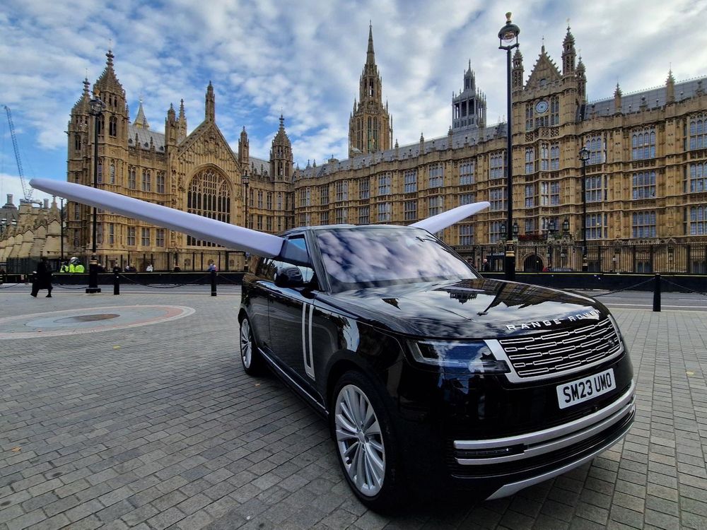 A large SUV with private jet wings