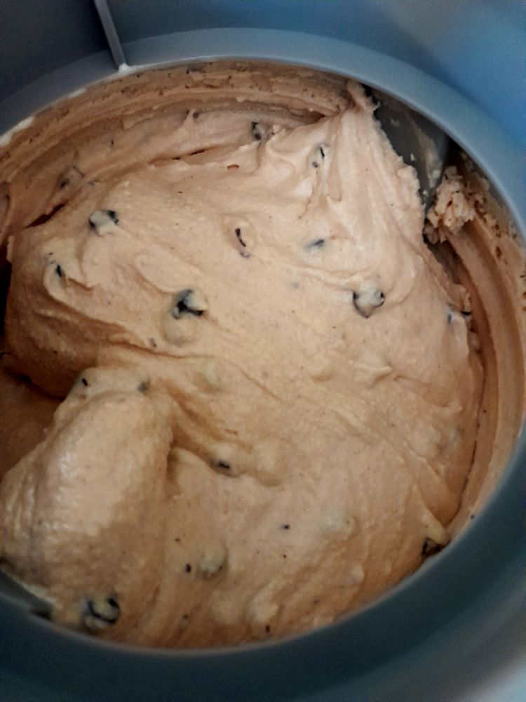 peanut butter chocolate chip ice cream churning in the ice cream maker.
