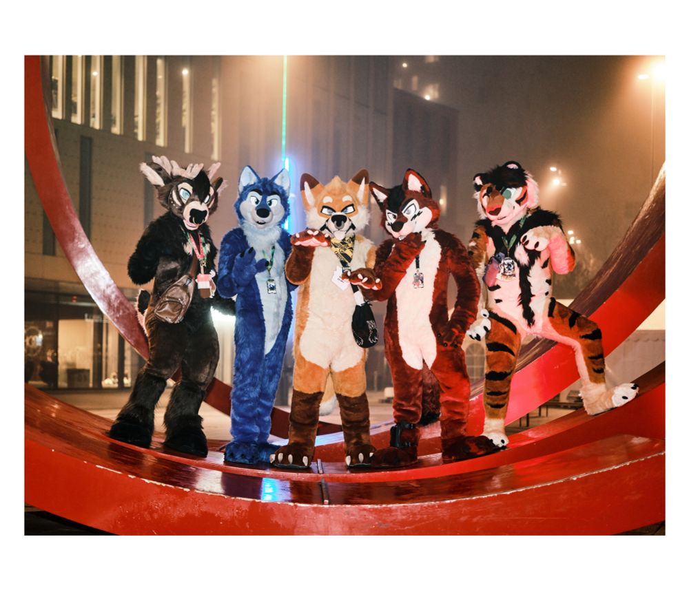 Photo of 5 fursuits on a structure at NordicFuzzCon