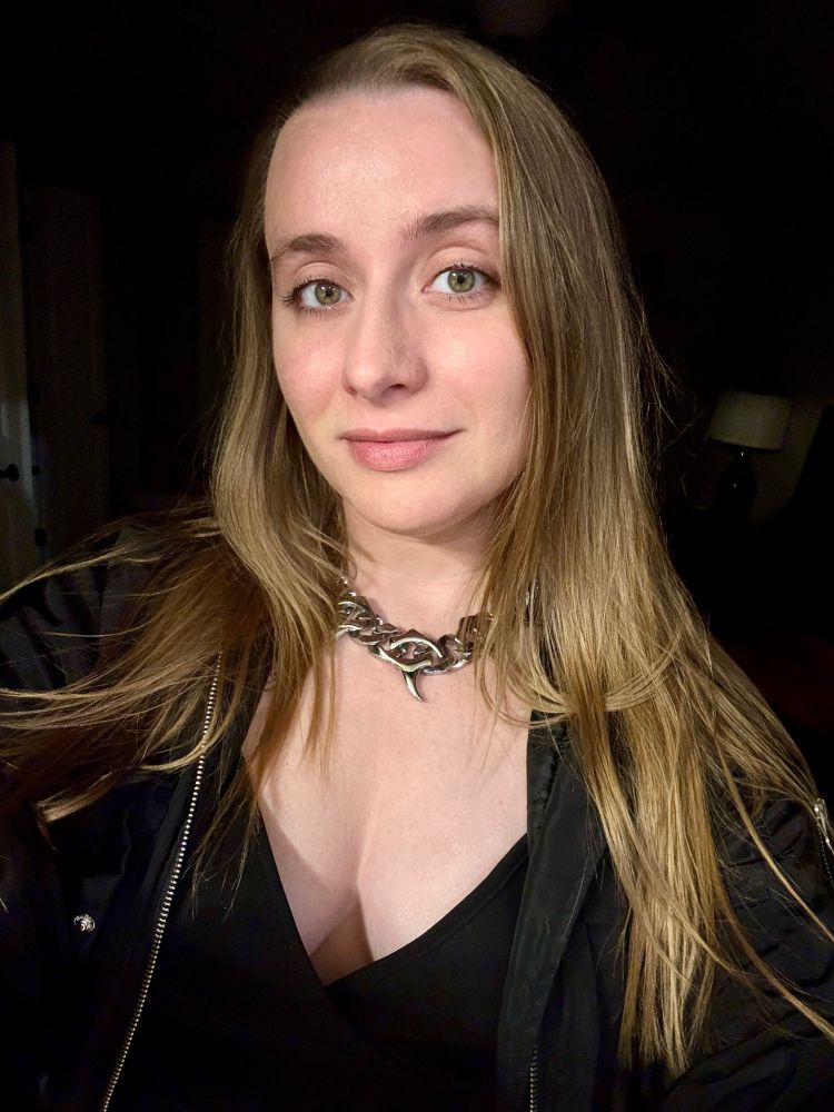 Alanis wearing a thick stainless steel chain 