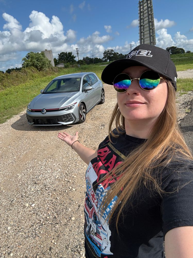 Alanis with a silver golf GTI 