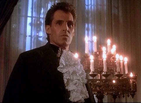 Ben Cross as vampire Barnabas Collins, with candelabra and puffy shirt. 