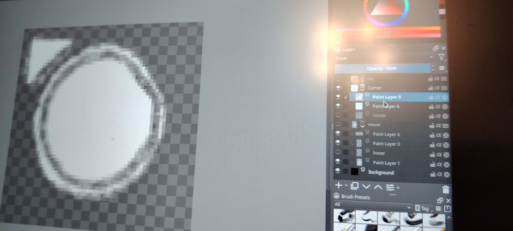 A hand drawn pointer cursor with a massive circle. The shot is more focused on the project's layers.