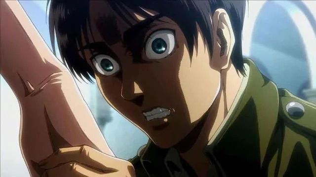 Stillframe of Attack on Titan, shows Eren‘s facial expression after touching Historia‘s hand and seeing premonitions the upcoming years of genocidal war