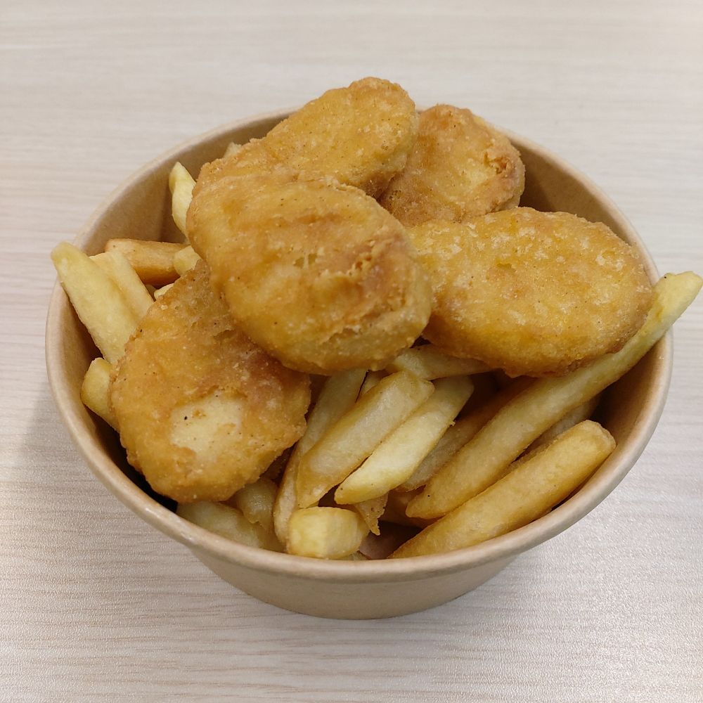 chicken nuggets and fries in a brown paper-made bowl