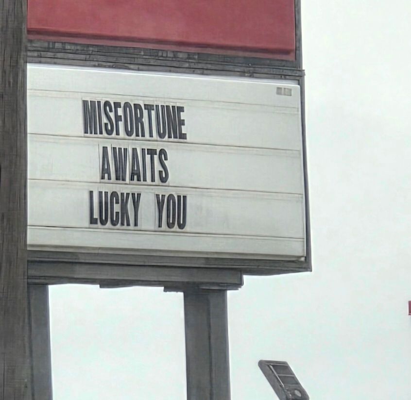 Sign at borger place, says MISFORTUNE AWAITS LUCKY YOU 