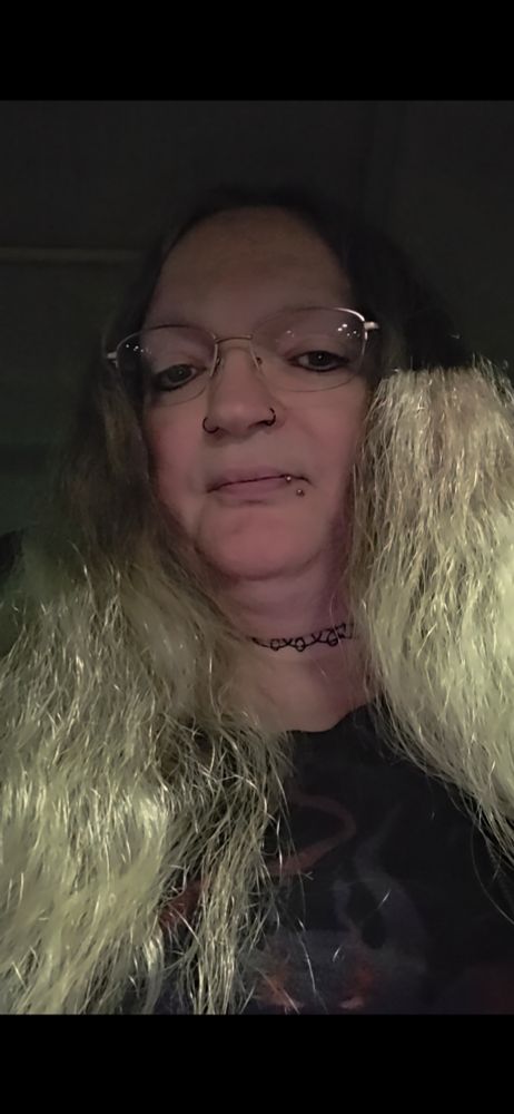 Me, an old trans woman almost smiling 