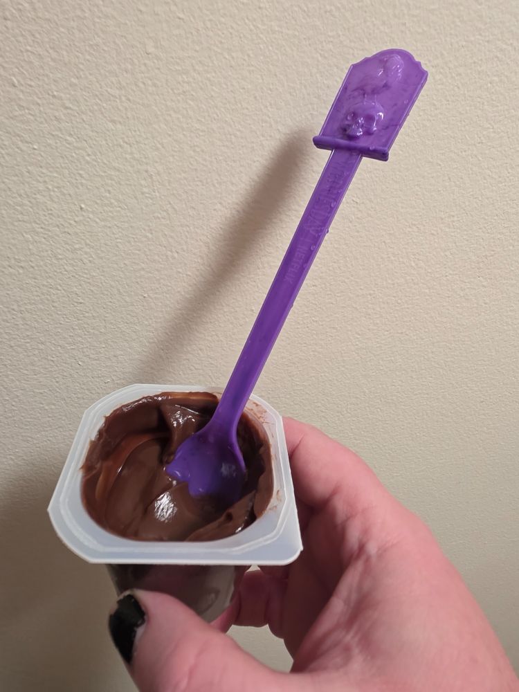Chocolate pudding cup with purple misfortune spoon from borger place