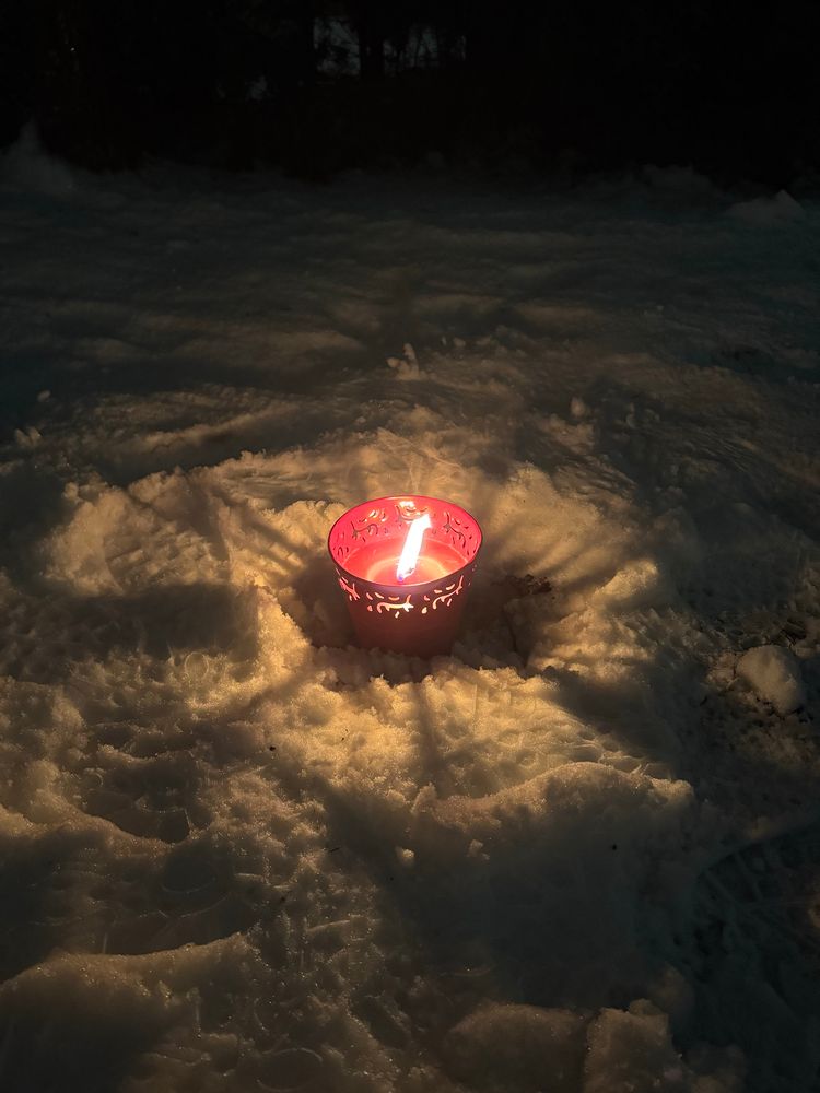A big candle in snow