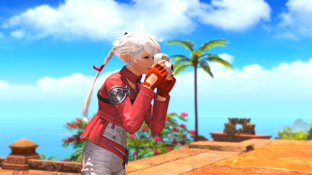 a bright sunny day in tuliyollal, alisaie holds up a small white camera, taking a picture of something off screen.