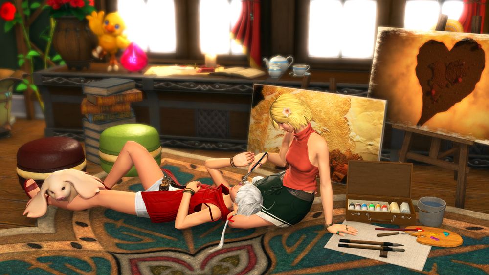 arya and alisaie lounge on the floor of a cozy, brightly lit room. sunlight streams in the windows, and they are surrounded by painted canvases, an open case of paints, a stack of books, and various other decorations. alisaie is laying with her head on arya's lap, reaching up for her while arya holds a paintbrush up to her cheek. angelo the porxie is flopped over alisaie's leg.