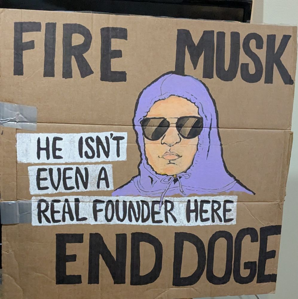 Mean Girls reference image of a character in a purple hoodie and sunglasses who said, "She doesn't even go here" in the film.

Here the text says "He isn't even a real founder here" in reference to how early investor Elon Musk legally obtained the title of co-founder at Tesla through a lawsuit settlement and not through the normal ways someone is considered literally a founder.