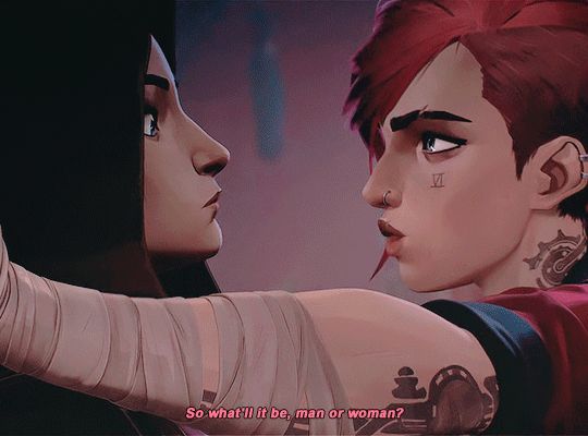 Clip of characters Vi and Caitlyn from animated show Arcane episode 104 - Caitlyn backed into a wall looking shocked, Vi leaning in to her, with her left arm against the wall Caitlyn is leaning on to crowd her. There is a caption reading “so what’ll it be, man or woman?” 