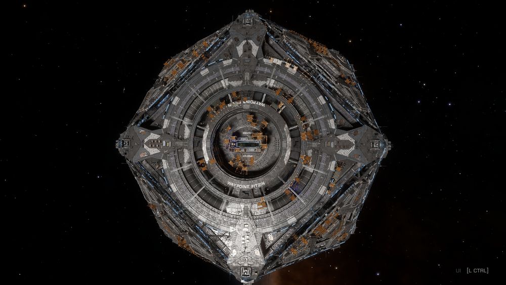 A screenshot of the game Elite Dangerous. A newly completed Coriolis Star Port with scaffolding still in place as it is finishing final preparations for deployment. The name "Waypoint Fitzin" is visible on the inner ring around the entry port.