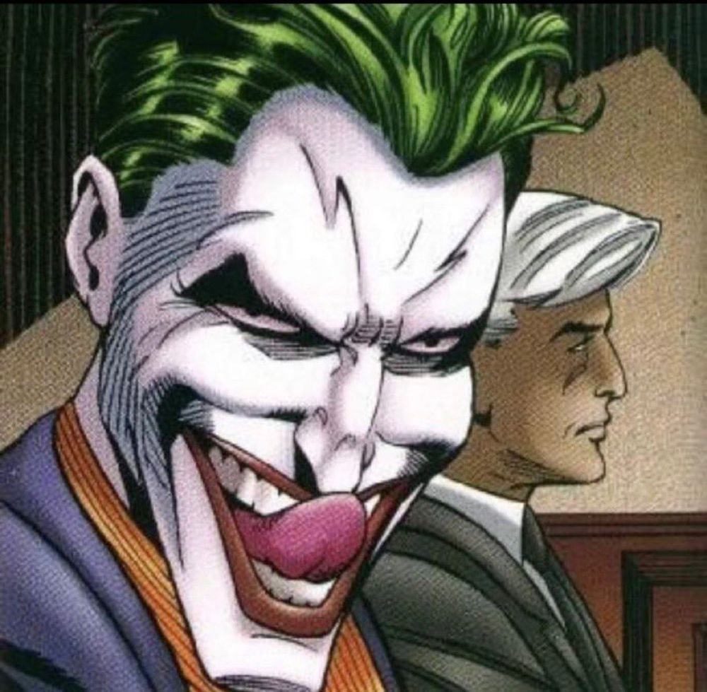 The joker staring straight ahead deviously with his tongue out
