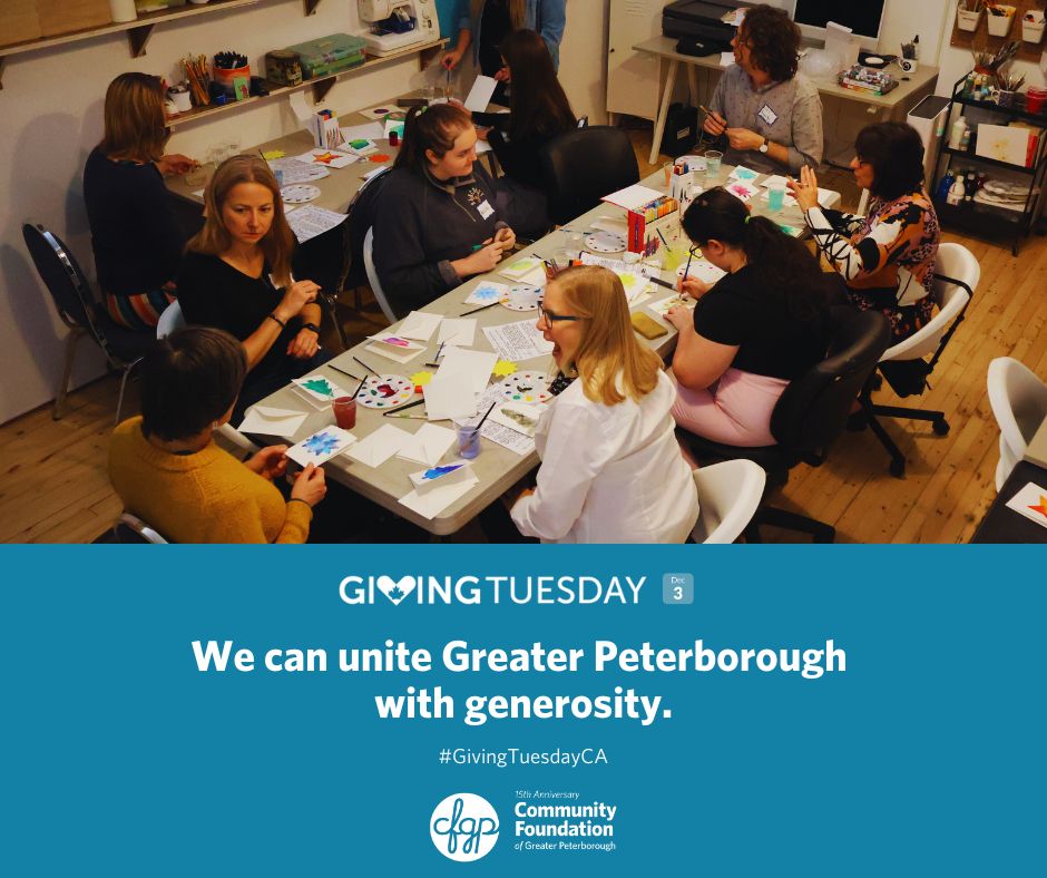 A photograph of people making art together. 