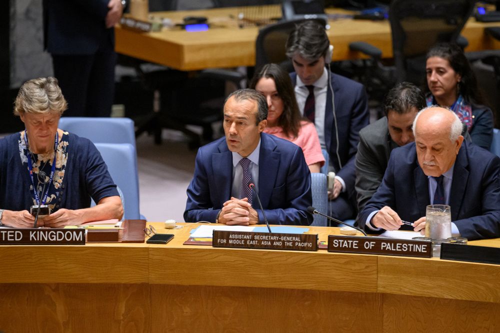 Khaled Khiari (centre), Assistant Secretary-General for the Middle East, Asia and the Pacific, Departments of Political and Peacebuilding Affairs and Peace Operations, briefs the Security Council meeting on the situation in the Middle East, including the Palestinian question. At right is Riyad Mansour, Permanent Observer of the State of Palestine to the United Nations, and at left is Barbara Woodward, Permanent Representative of the United Kingdom to the United Nations.