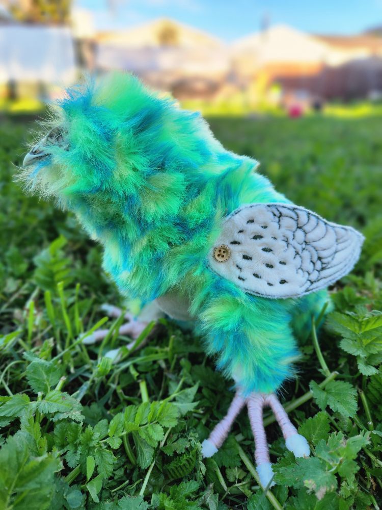 Quail art doll, skull head, green body with yellow spots