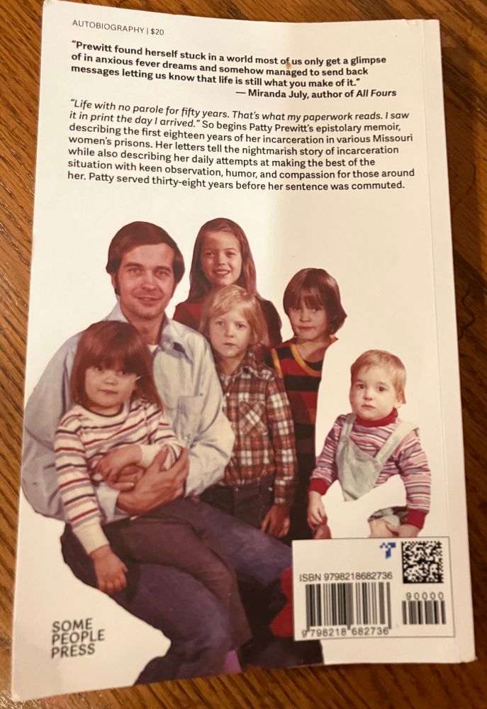 Patty’s husband and their five young children are pictured on the back cover with Patty whited out. A quote and summary of the book is above them. 