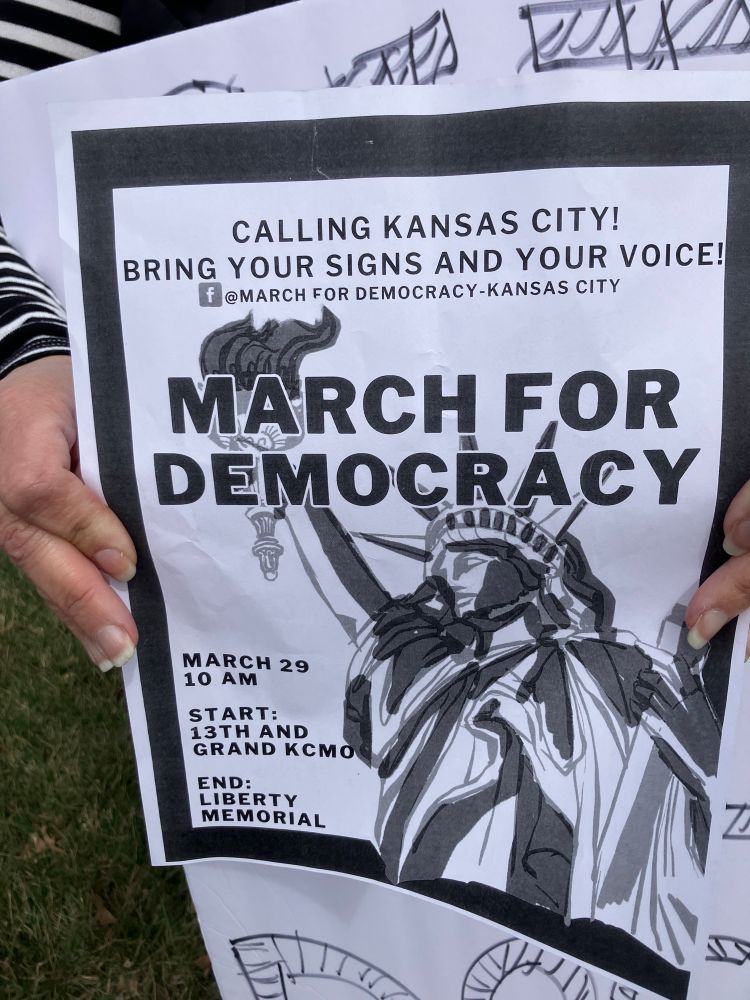 Flier for March for Democracy Saturday March 29 10 a.m. beginning at 13th and Grand, ending at Liberty Memorial. 