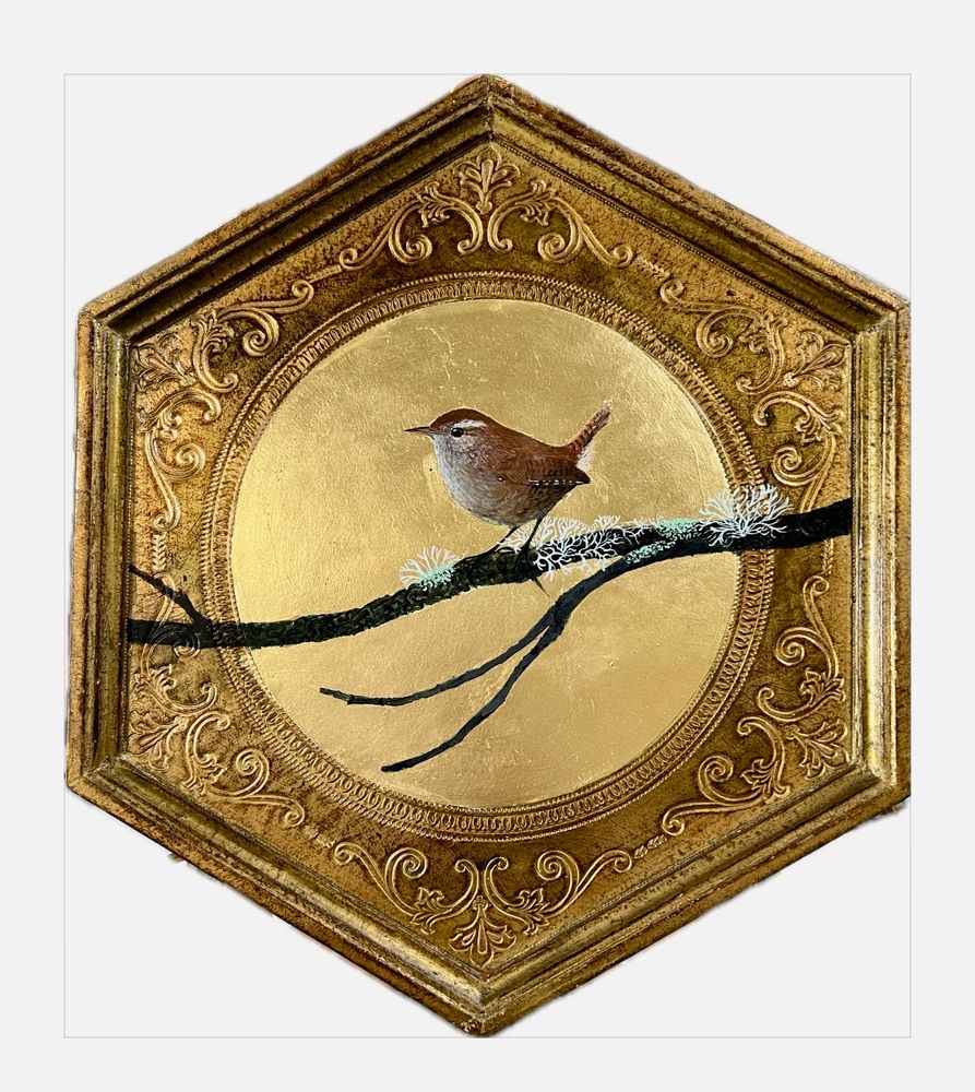A painting of a wren on gold leaf